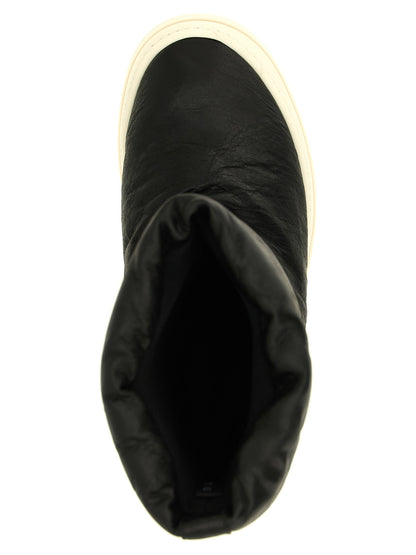 Platform Winter Boots by Rick Owens for men in lamb leather bicolour, black, cream & white features an high-performance silhouette, showcasing the sophisticated design of the Men's Lamb Leather Platform Winter Boots with a platform and a refined .