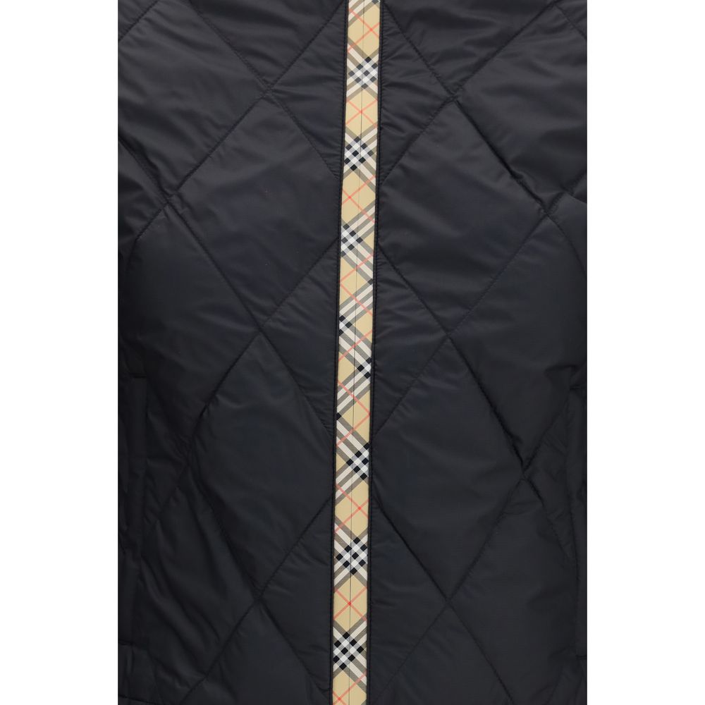 Overcoat by Burberry for women in nylon & silicone black features a contemporary silhouette showcasing a contemporary and refined pockets for a sophisticated finish.