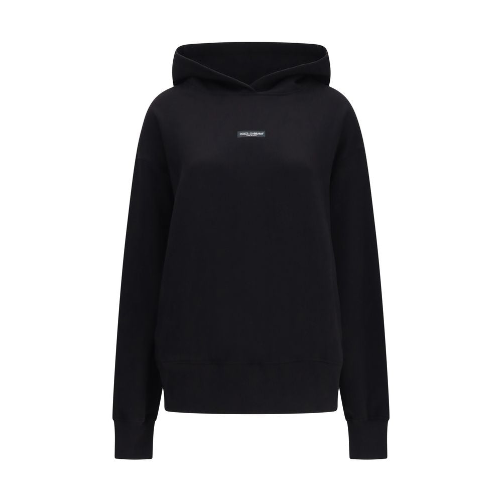 Sweatshirt Hoodie by Dolce & Gabbana for women in cotton black features an dramatic silhouette, showcasing a sophisticated hooded neckline and dramatic long-sleeve for a refined, modern aesthetic.
