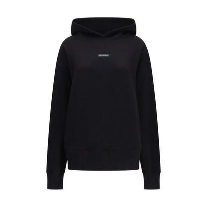 Sweatshirt Hoodie by Dolce & Gabbana for women in cotton black features an dramatic silhouette, showcasing a sophisticated hooded neckline and dramatic long-sleeve for a refined, modern aesthetic.