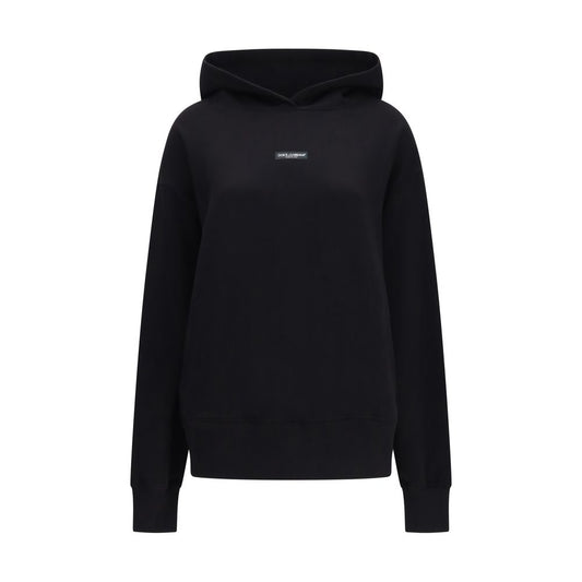 Sweatshirt Hoodie by Dolce & Gabbana for women in cotton black features an dramatic silhouette, showcasing a sophisticated hooded neckline and dramatic long-sleeve for a refined, modern aesthetic.
