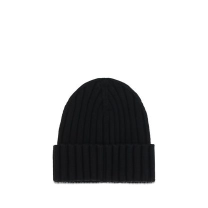 Beanie Hat by Moncler for women in merino wool black & signature features a distinguished knit construction, showcasing the sophisticated silhouette and distinguished finish of the Merino Wool Beanie Hat.