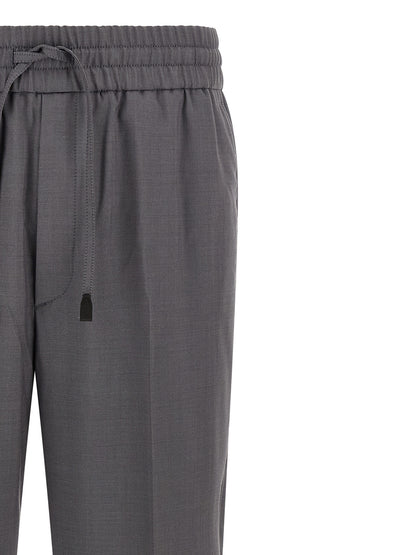 Trousers by Brioni for men in wool gray features an sartorial silhouette, showcasing a precise straight-leg and long with a sartorial for a refined look.