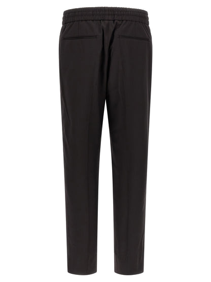 Trousers by Brioni for men in virgin wool brown features a sculptural silhouette, showcasing a sculptural straight and long with a sophisticated for a sculptural finish.