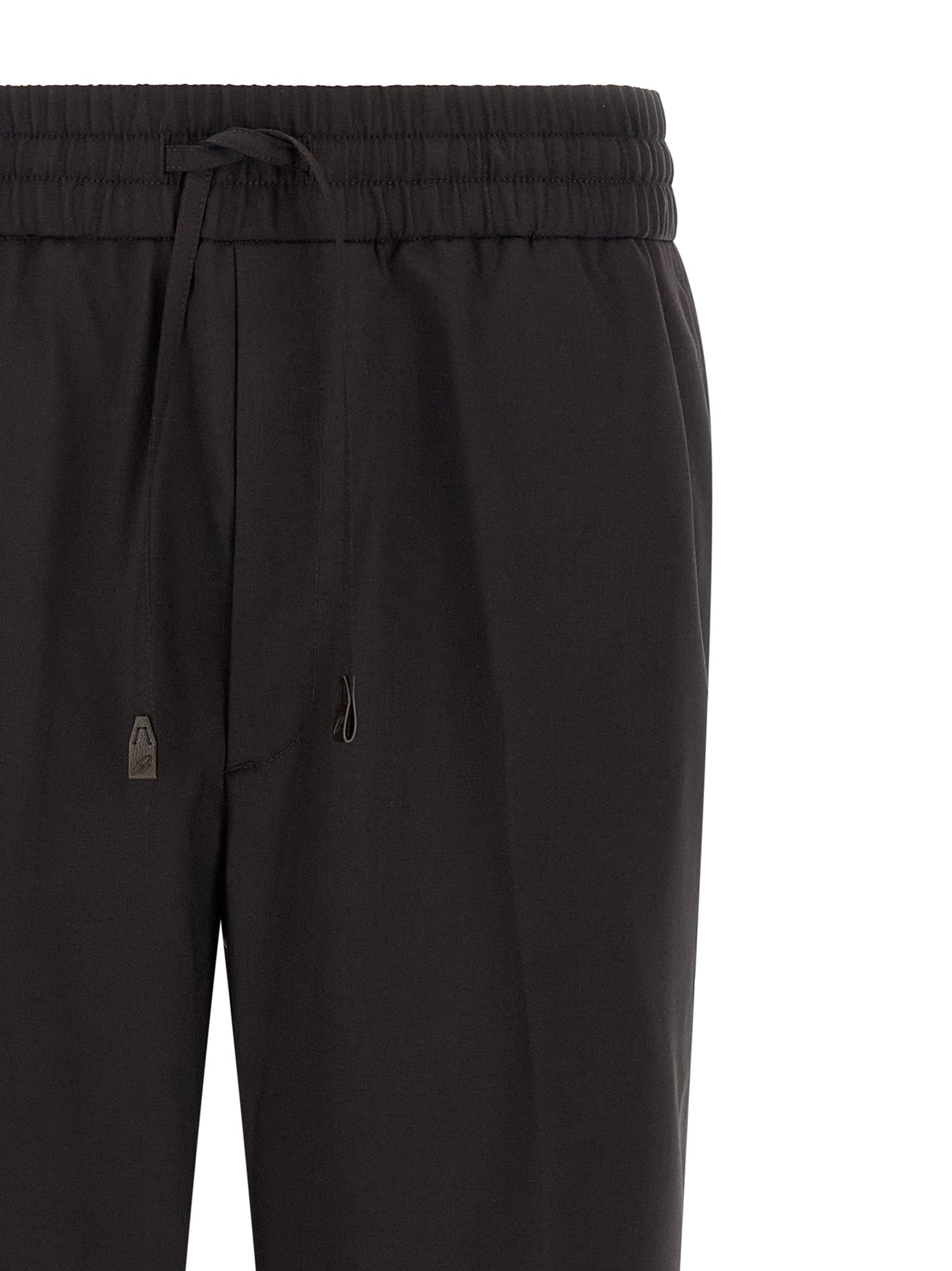 Trousers by Brioni for men in virgin wool brown features a artisanal silhouette, showcasing a sophisticated straight with a long and for a artisanal finish.
