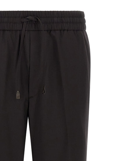 Trousers by Brioni for men in virgin wool brown features a artisanal silhouette, showcasing a sophisticated straight with a long and for a artisanal finish.