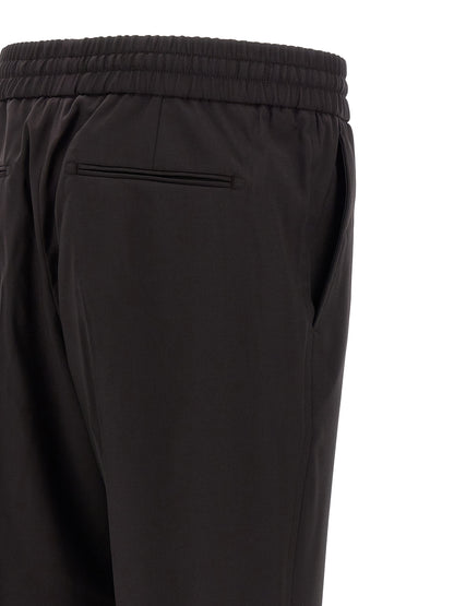 Trousers by Brioni for men in virgin wool brown features a tailored silhouette with a tailored straight, defined by its long and a sophisticated .
