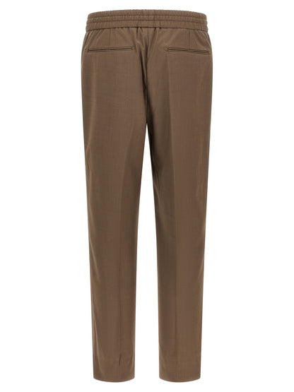 Trousers by Brioni for men in wool brown features an on trend silhouette, showcasing a sophisticated straight with a long and for an on trend finish.