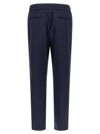 Trousers by Brioni for men in wool navy presents a smart silhouette, meticulously detailed with a smart straight-leg, a smart long, and a smart .