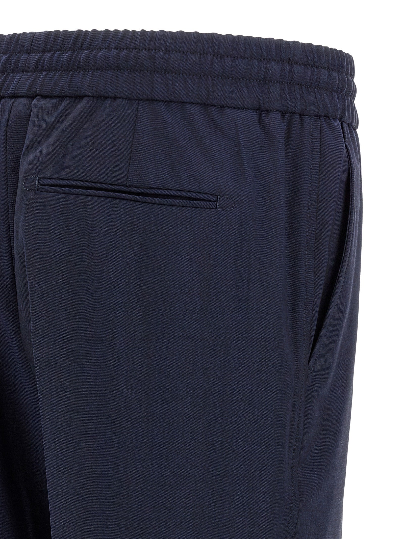 Trousers by Brioni for men in wool navy presents a perennial silhouette, meticulously tailored with a straight-leg cut, long finish, and an elegant .