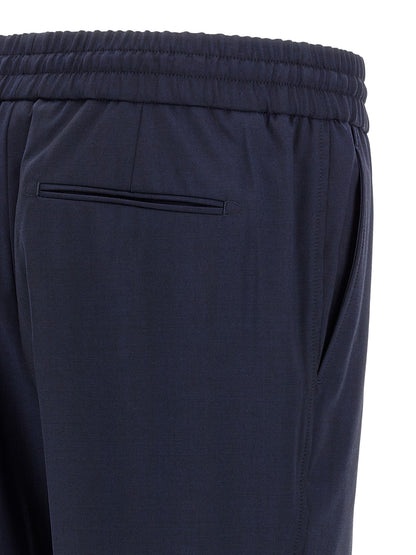 Trousers by Brioni for men in wool navy presents a perennial silhouette, meticulously tailored with a straight-leg cut, long finish, and an elegant .