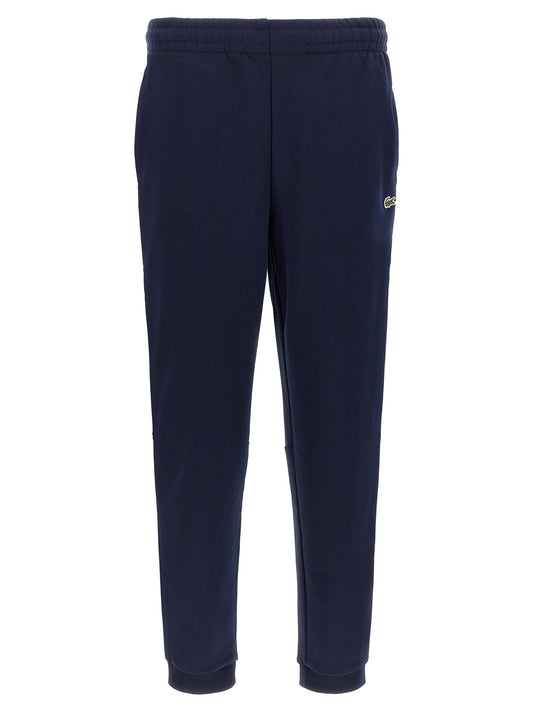 Joggers by Lacoste for men in crocodile skin leather & cotton navy features a refined silhouette with a refined , defined by a and a refined long for a refined finish.