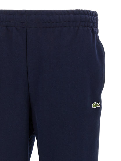 Joggers by Lacoste for men in crocodile skin leather & cotton navy features an sophisticated and with a precise long, creating a sophisticated and sophisticated silhouette.