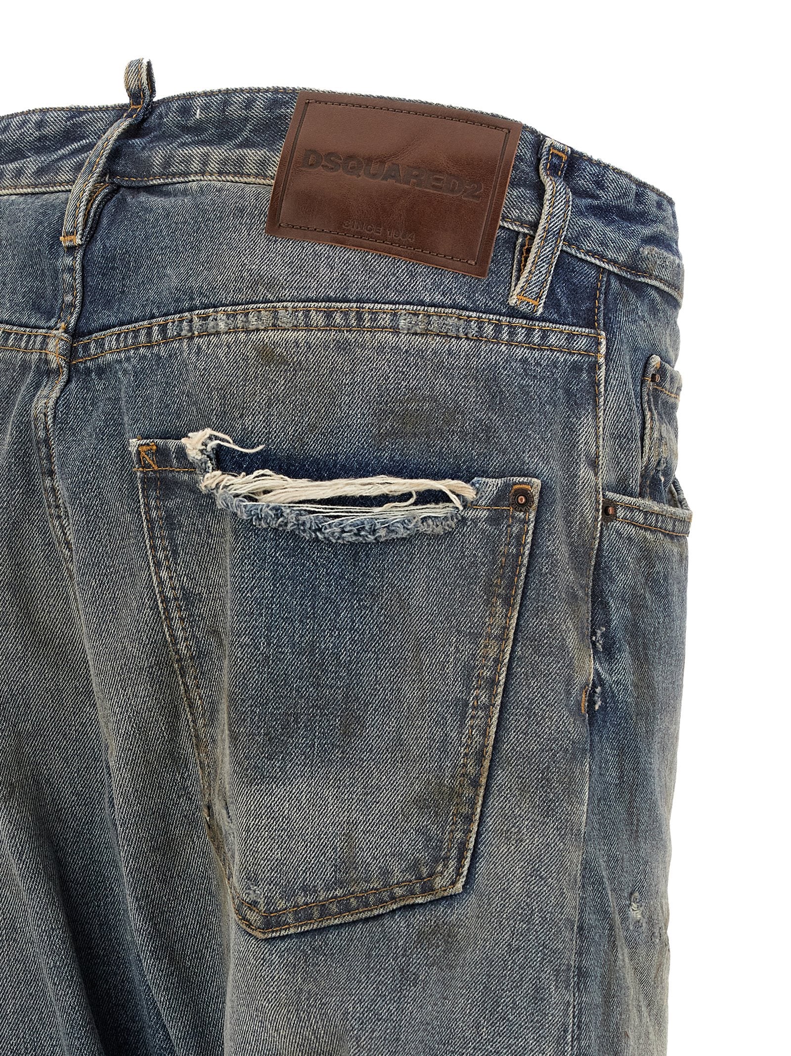Jeans by Dsquared² for men in cotton denim blue, brown, red & signature features a refined silhouette with a refined relaxed-fit & cropped, defined by a and a refined cropped for a refined finish.