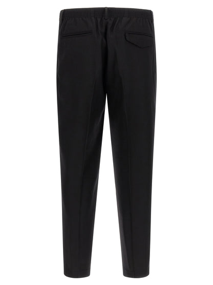 Trousers by CELLAR DOOR for men in virgin wool black presents a perennial silhouette, meticulously tailored with a tapered-leg cut, long finish, and an elegant .
