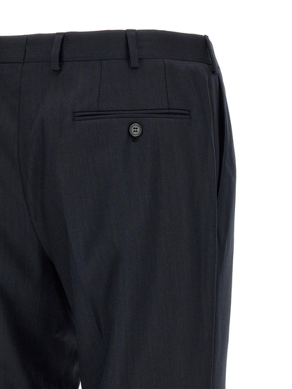 Pant Suit by Brioni for men in virgin wool blue showcases a sartorial silhouette, artfully detailed with a sophisticated and a sartorial straight for a refined, high-fashion aesthetic.