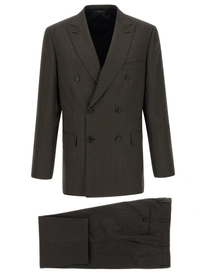 This Pant Suit by Brioni for men in wool brown presents a discerning silhouette, featuring a sophisticated and a discerning for a refined and polished look.