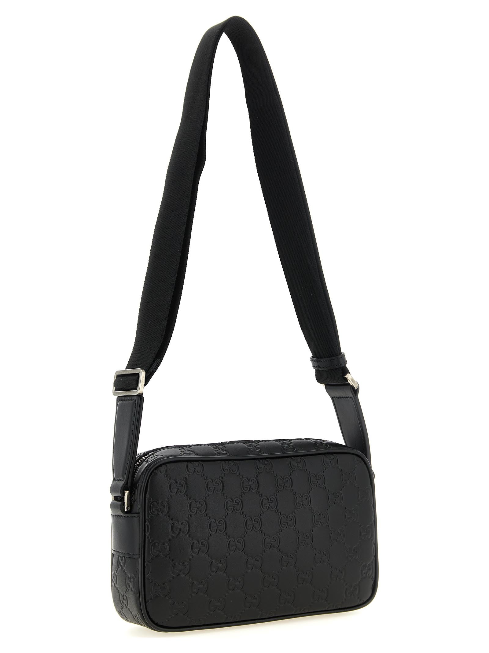 Crossbody Camera Messenger Bag by Gucci for men in linen cotton canvas & calfskin leather black, silver, patterned & monogram showcases a stylish Gg Linen Cotton Canvas & Calfskin Leather Crossbody Camera Messenger Bag design, featuring a secure zipper and ample external-pockets with versatile crossbody-strap, shoulder-strap & adjustable-strap for a stylish look.