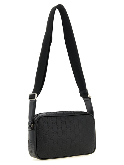 Crossbody Camera Messenger Bag by Gucci for men in linen cotton canvas & calfskin leather black, silver, patterned & monogram showcases a stylish Gg Linen Cotton Canvas & Calfskin Leather Crossbody Camera Messenger Bag design, featuring a secure zipper and ample external-pockets with versatile crossbody-strap, shoulder-strap & adjustable-strap for a stylish look.