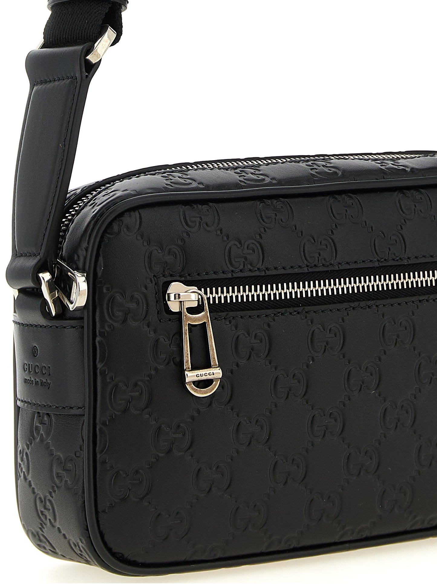 This Crossbody Camera Messenger Bag by Gucci for men in linen cotton canvas & calfskin leather black, silver, patterned & monogram presents a versatile silhouette from the Gg Linen Cotton Canvas & Calfskin Leather Crossbody Camera Messenger Bag collection, featuring a secure zipper, ample external-pockets, and versatile crossbody-strap, shoulder-strap & adjustable-strap.