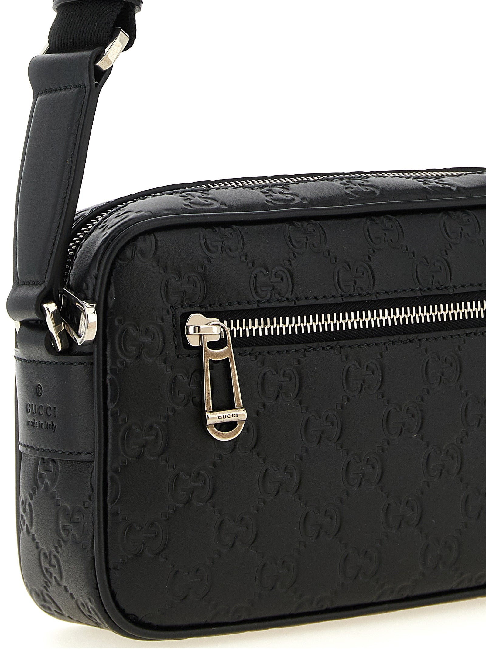 This Crossbody Camera Messenger Bag by Gucci for men in linen cotton canvas & calfskin leather black, silver, patterned & monogram presents a versatile silhouette from the Gg Linen Cotton Canvas & Calfskin Leather Crossbody Camera Messenger Bag collection, featuring a secure zipper, ample external-pockets, and versatile crossbody-strap, shoulder-strap & adjustable-strap.