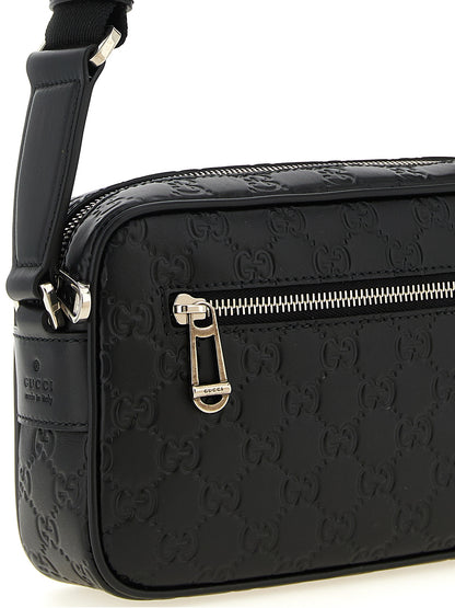 This Crossbody Camera Messenger Bag by Gucci for men in linen cotton canvas & calfskin leather black, silver, patterned & monogram presents a versatile silhouette from the Gg Linen Cotton Canvas & Calfskin Leather Crossbody Camera Messenger Bag collection, featuring a secure zipper, ample external-pockets, and versatile crossbody-strap, shoulder-strap & adjustable-strap.