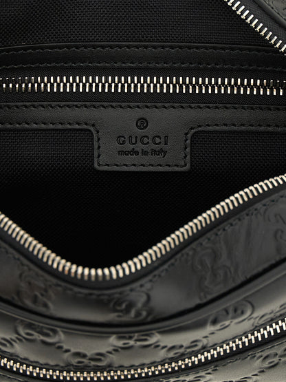 Crossbody Camera Messenger Bag by Gucci for men in linen cotton canvas & calfskin leather black, silver, patterned & monogram features a distinguished Gg Linen Cotton Canvas & Calfskin Leather Crossbody Camera Messenger Bag design with a secure zipper, ample external-pockets, and versatile crossbody-strap, shoulder-strap & adjustable-strap for a distinguished look.