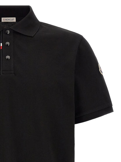 This Polo Shirt by Moncler for men in cotton felt black presents a flawless silhouette, showcasing flawless detailing and a refined for a truly flawless aesthetic.