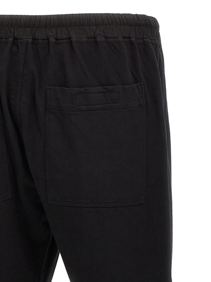 Casual Pants by DRKSHDW for men in cotton black presents a tailored silhouette, showcasing a tailored straight-leg and long cut with a refined for a truly tailored aesthetic.