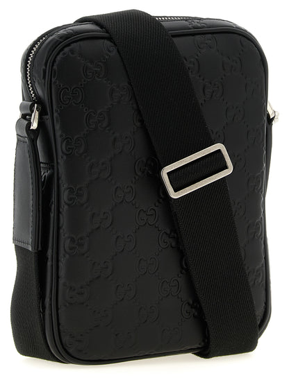 2-in-1 Shoulder & Crossbody Messenger Bag by Gucci for men in bos taurus calfskin leather black & patterned features a distinguished Gg Bos Taurus Calfskin Leather 2-in-1 Shoulder & Crossbody Messenger Bag design with a secure zipper, ample , and versatile crossbody-strap, shoulder-strap & adjustable-strap for a distinguished look.