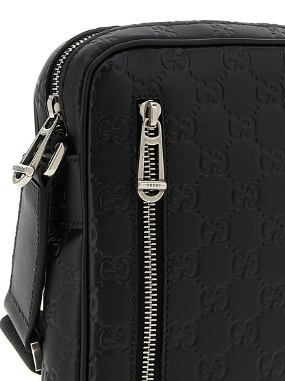 This 2-in-1 Shoulder & Crossbody Messenger Bag by Gucci for men in bos taurus calfskin leather black & patterned presents a versatile silhouette from the Gg Bos Taurus Calfskin Leather 2-in-1 Shoulder & Crossbody Messenger Bag collection, featuring a secure zipper, ample , and versatile crossbody-strap, shoulder-strap & adjustable-strap.