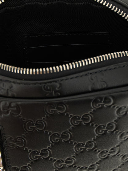 2-in-1 Shoulder & Crossbody Messenger Bag by Gucci for men in bos taurus calfskin leather black & patterned showcases a stylish Gg Bos Taurus Calfskin Leather 2-in-1 Shoulder & Crossbody Messenger Bag design, featuring a secure zipper and ample with versatile crossbody-strap, shoulder-strap & adjustable-strap for a stylish look.
