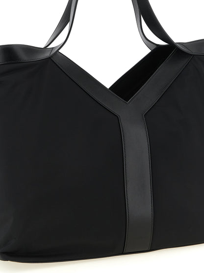 Large Tote Bag by Saint Laurent for men in bos taurus calfskin leather & polyamide black features an metropolitan chic City Bos Taurus Calfskin Leather & Polyamide Large Tote Bag design with a secure , metropolitan chic , and versatile handle for a metropolitan chic look.