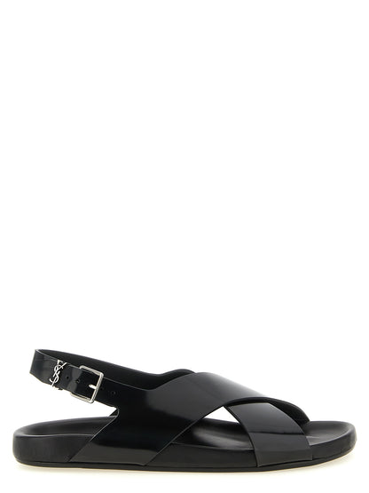 Flat Slingback Sandals by Saint Laurent for men in bos taurus calfskin leather black & silver features an effortlessly chic silhouette from the Cassandre Men's Bos Taurus Calfskin Leather Flat Slingback Sandals collection, showcasing a effortlessly chic flat and elegant .