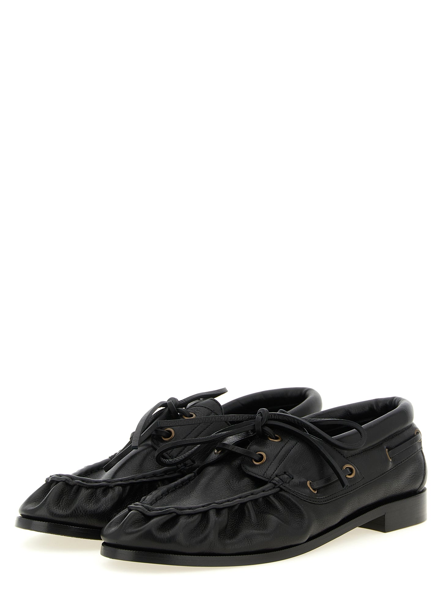 Loafer Slip-On Shoes by Saint Laurent for men in calfskin leather black & gold showcases a impeccable silhouette as Cassandre Men's Calfskin Leather Loafer Slip-On Shoes, artfully designed with a impeccable and refined moc toe style for a impeccable finish.
