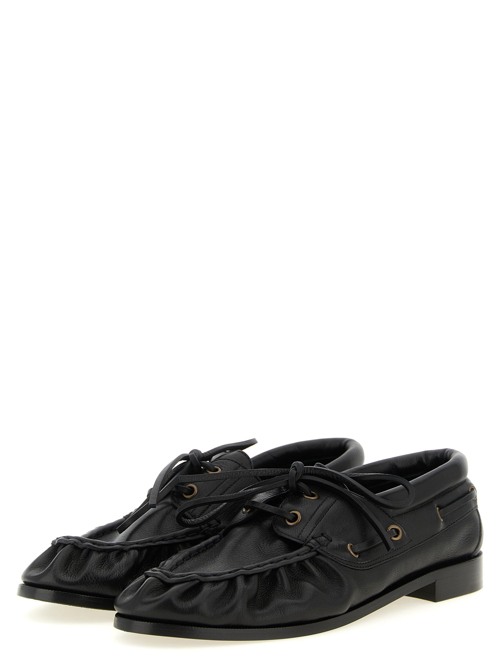 Loafer Slip-On Shoes by Saint Laurent for men in calfskin leather black & gold showcases a impeccable silhouette as Cassandre Men's Calfskin Leather Loafer Slip-On Shoes, artfully designed with a impeccable and refined moc toe style for a impeccable finish.