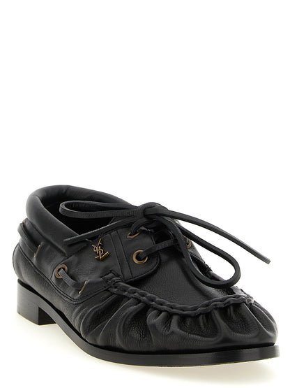 Loafer Slip-On Shoes by Saint Laurent for men in calfskin leather black & gold showcases a resplendent Cassandre Men's Calfskin Leather Loafer Slip-On Shoes aesthetic, defined by its resplendent moc toe style and elegant .
