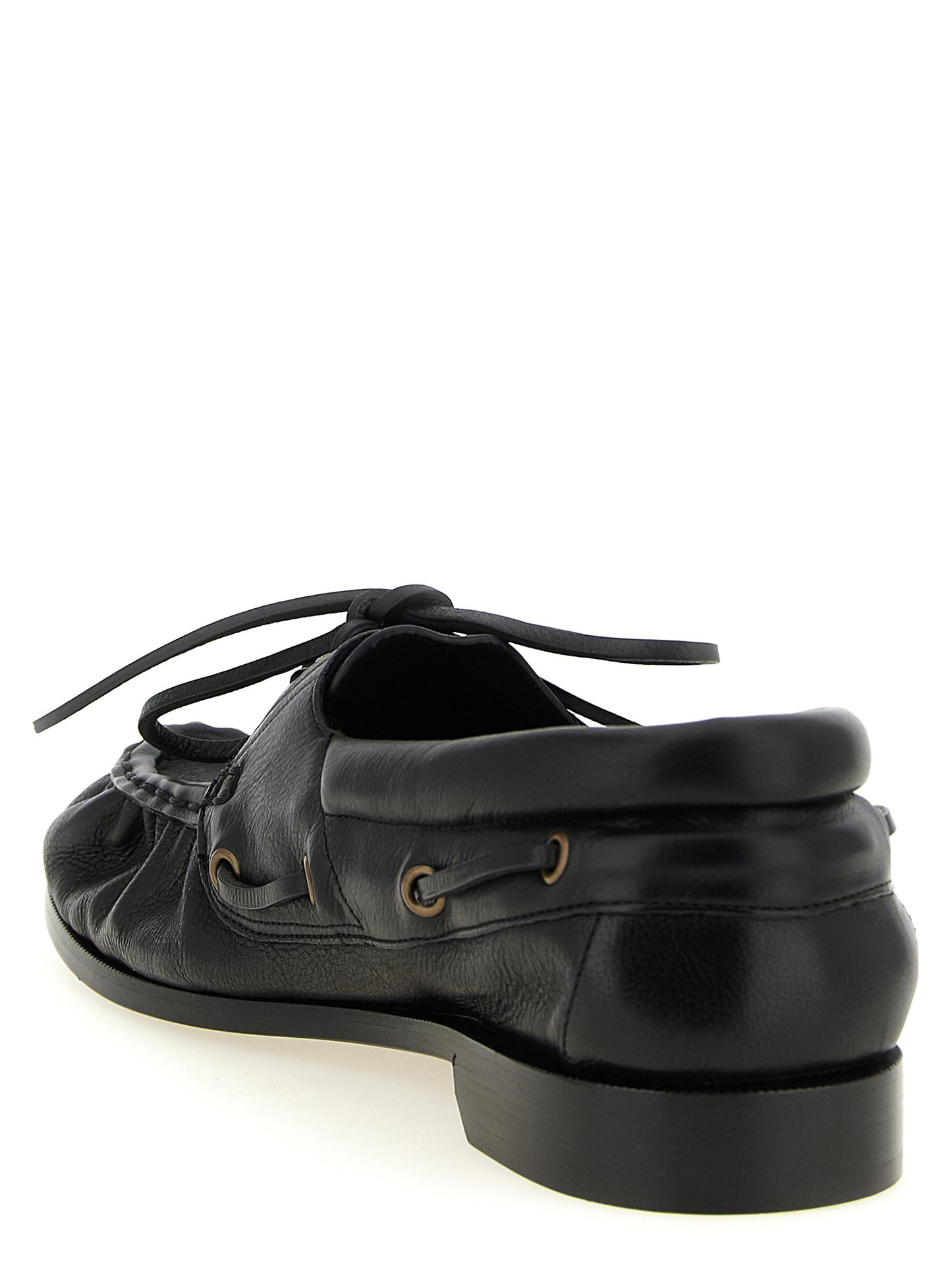 This Loafer Slip-On Shoes by Saint Laurent for men in calfskin leather black & gold features an exquisite silhouette from the Cassandre Men's Calfskin Leather Loafer Slip-On Shoes collection, defined by a sophisticated and elegant moc toe style.