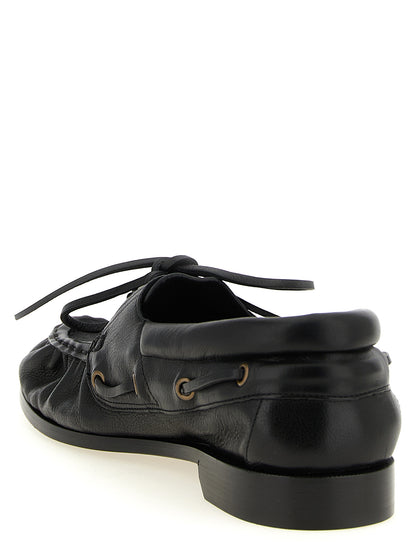 This Loafer Slip-On Shoes by Saint Laurent for men in calfskin leather black & gold features an exquisite silhouette from the Cassandre Men's Calfskin Leather Loafer Slip-On Shoes collection, defined by a sophisticated and elegant moc toe style.
