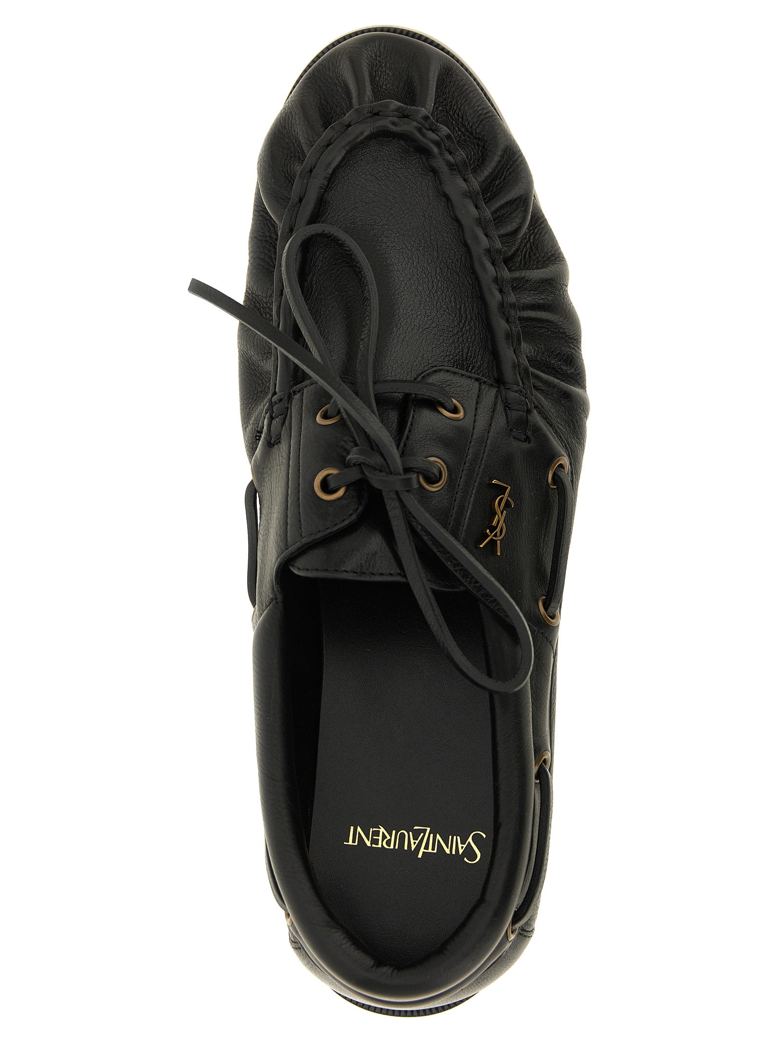 Loafer Slip-On Shoes by Saint Laurent for men in calfskin leather black & gold features an ergonomic silhouette, perfectly showcasing Cassandre Men's Calfskin Leather Loafer Slip-On Shoes with its distinct and elegant moc toe style.