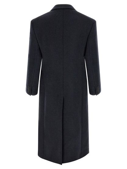 Overcoat by Saint Laurent for men in virgin wool navy showcases a architectural silhouette, artfully detailed with a distinctive split neckline and functional pockets & insulated for a architectural finish.