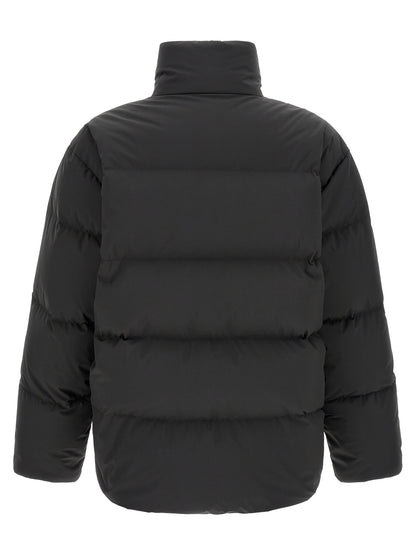 Puffer Jacket by Saint Laurent for men in polyester black showcases a bohemian silhouette, artfully detailed with a bohemian high-neck neckline and signature pockets & insulated for a truly bohemian finish.