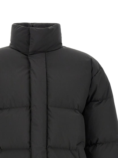 Puffer Jacket by Saint Laurent for men in polyester black features a city-ready silhouette, detailed with pockets & insulated and a city-ready high-neck neckline.
