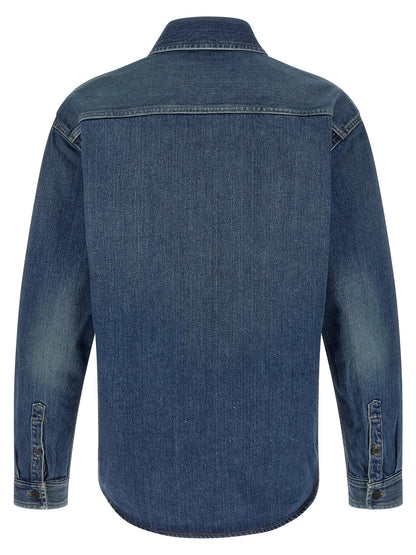 Shirt by Saint Laurent for men in denim cotton blue showcases a sharp silhouette, elegantly detailed with a sharp and sharp .