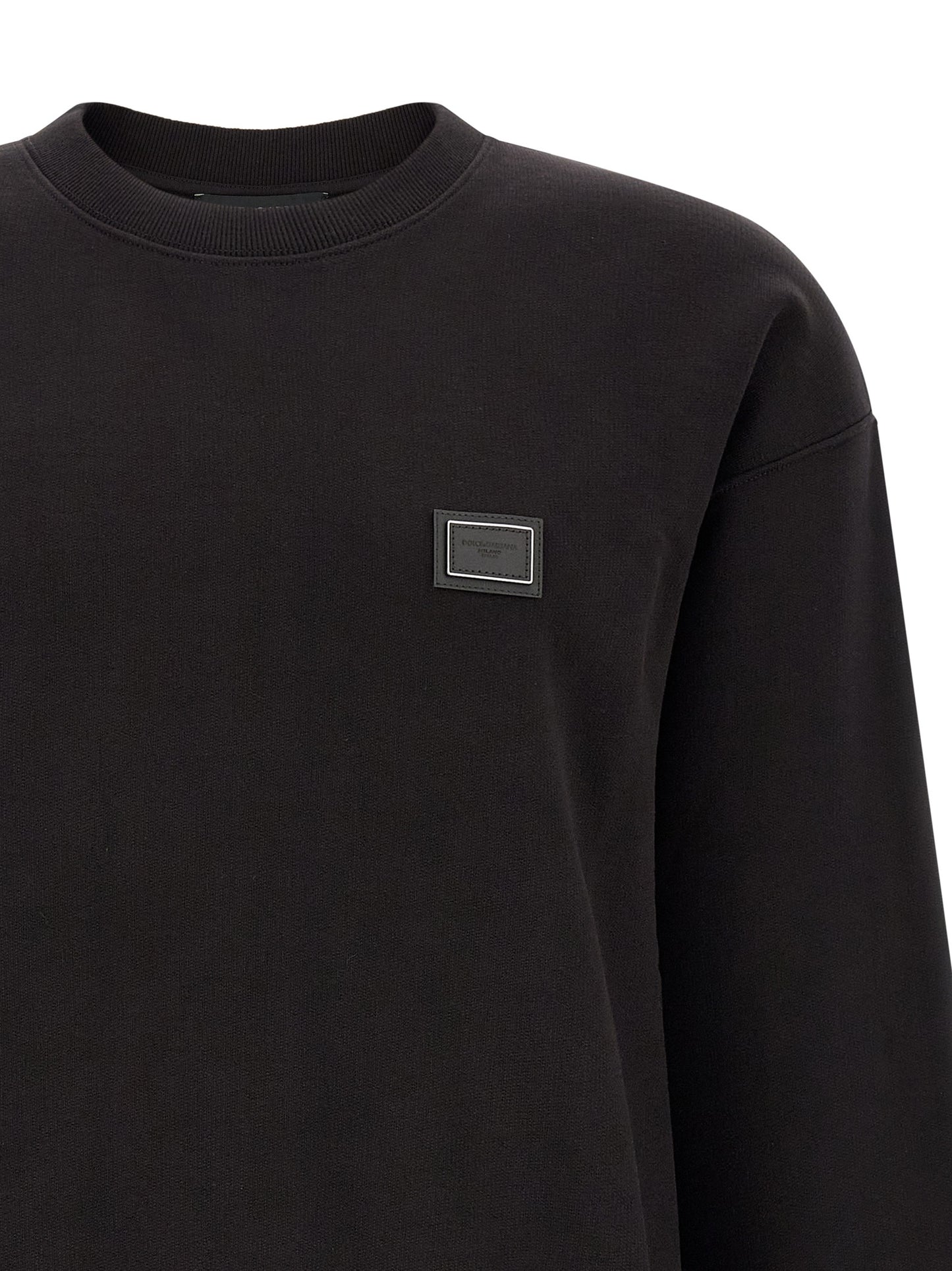 Sweatshirt by Dolce & Gabbana for men in cotton black features an provocated silhouette, detailed with a provocated and a refined crew neckline for a sophisticated aesthetic.
