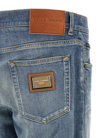 Jeans by Dolce & Gabbana for men in stretch denim cotton blue presents a refined pantology silhouette, artfully defined by a refined pantology straight-leg, long, and a sophisticated low rise.
