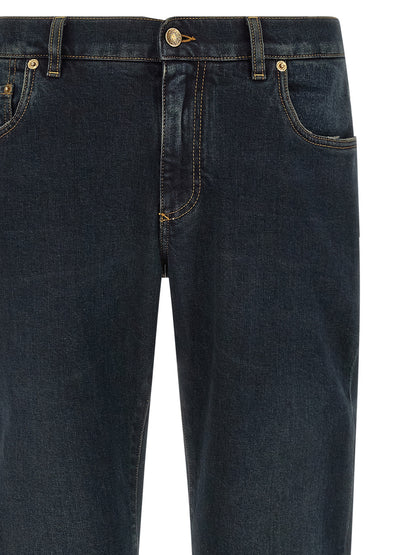Jeans by Dolce & Gabbana for men in stretch denim cotton blue, gold & signature presents a tailored silhouette, showcasing a tailored skinny and long cut with a refined for a truly tailored aesthetic.
