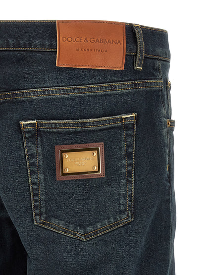 Jeans by Dolce & Gabbana for men in stretch denim cotton blue, gold & signature features an sartorial skinny and long with a cut for a sartorial finish.