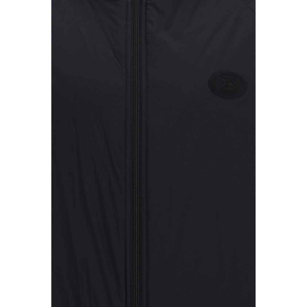 Hooded Windbreaker Jacket by Burberry for men in nylon & silicone black & signature features an enduring silhouette, showcasing technical lightweight, pockets, hooded & windproof and a sophisticated hooded neckline for a truly enduring aesthetic.