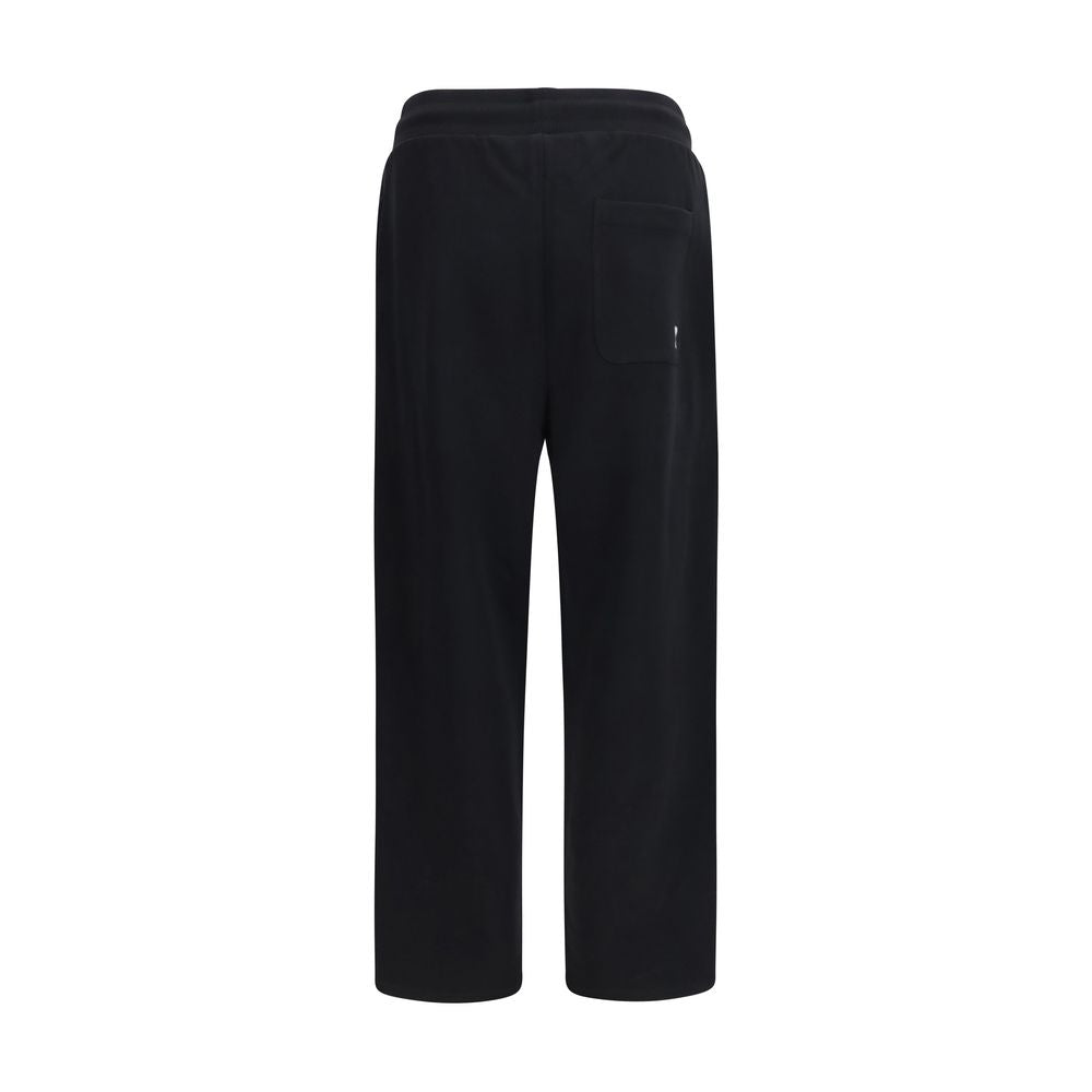 Jogger Sweatpants by Ami Paris for men in cotton black features an kinetic relaxed-fit, regular-fit & wide and long with a , showcasing high-performance for an kinetic look.
